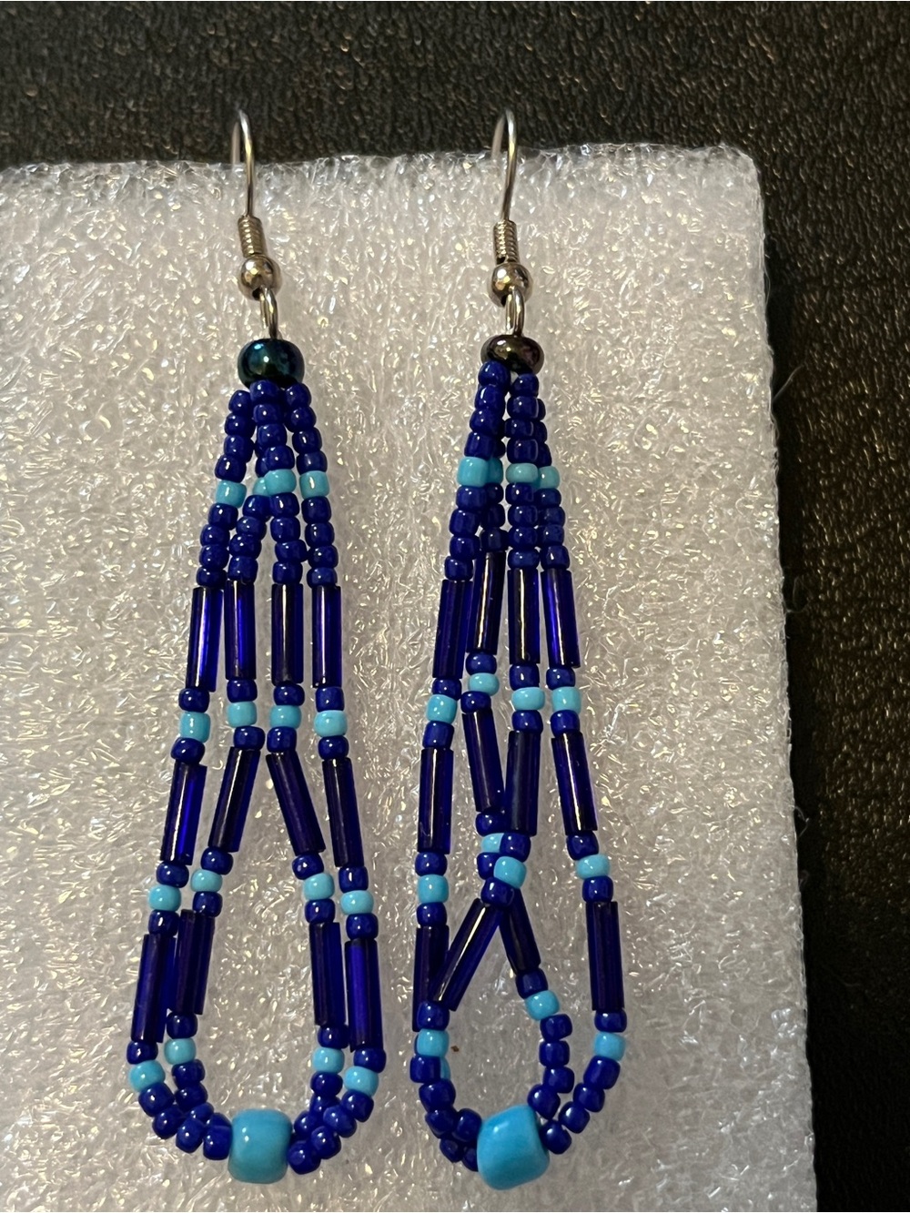 Blue and light blue seed and bugle bead dangle earrings